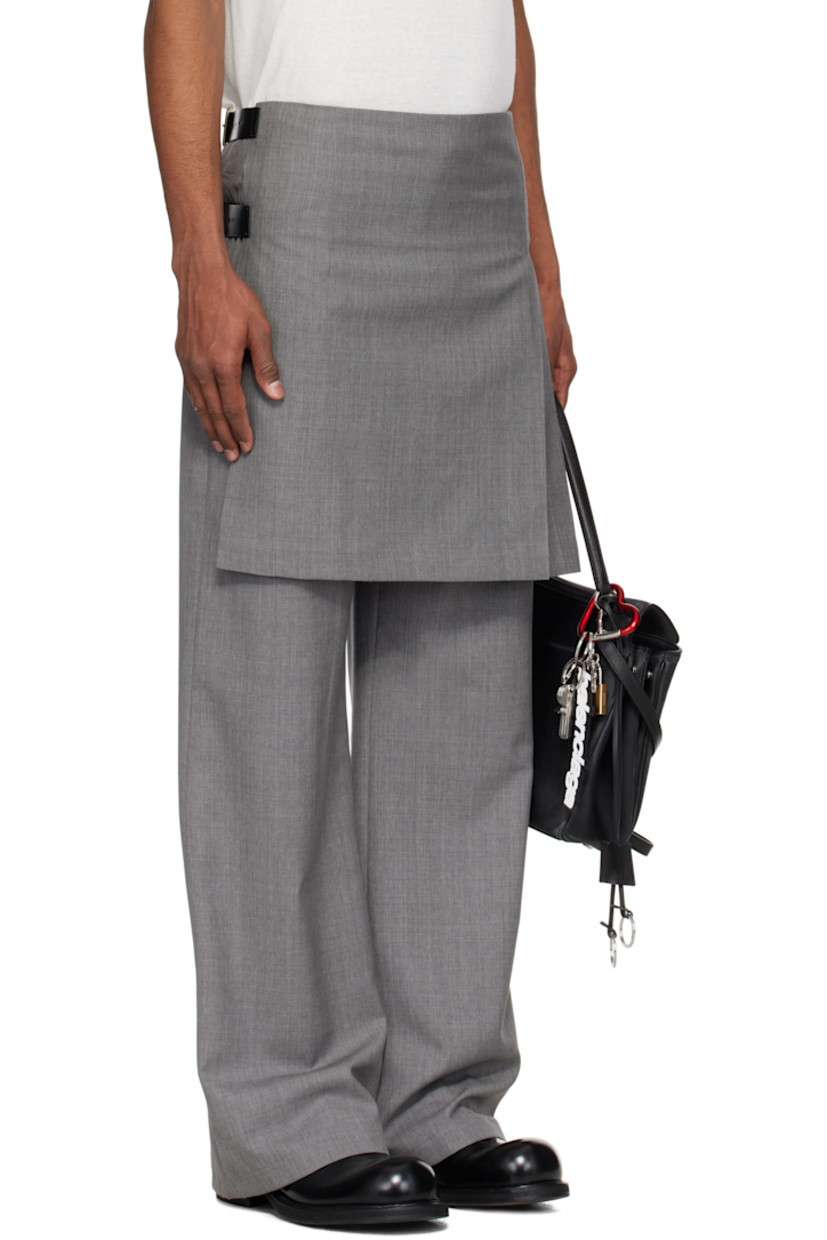 Virgin wool delaine trousers.

· Layered construction
· Pleated kilt-style overlay at waist
· Concealed zip fly
· Pin-buckle straps at outseam

Supplier color: Grey