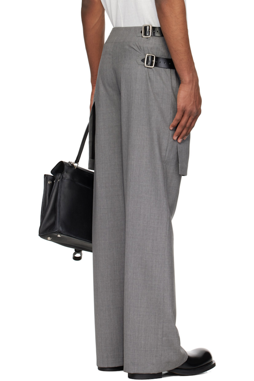 Virgin wool delaine trousers.

· Layered construction
· Pleated kilt-style overlay at waist
· Concealed zip fly
· Pin-buckle straps at outseam

Supplier color: Grey