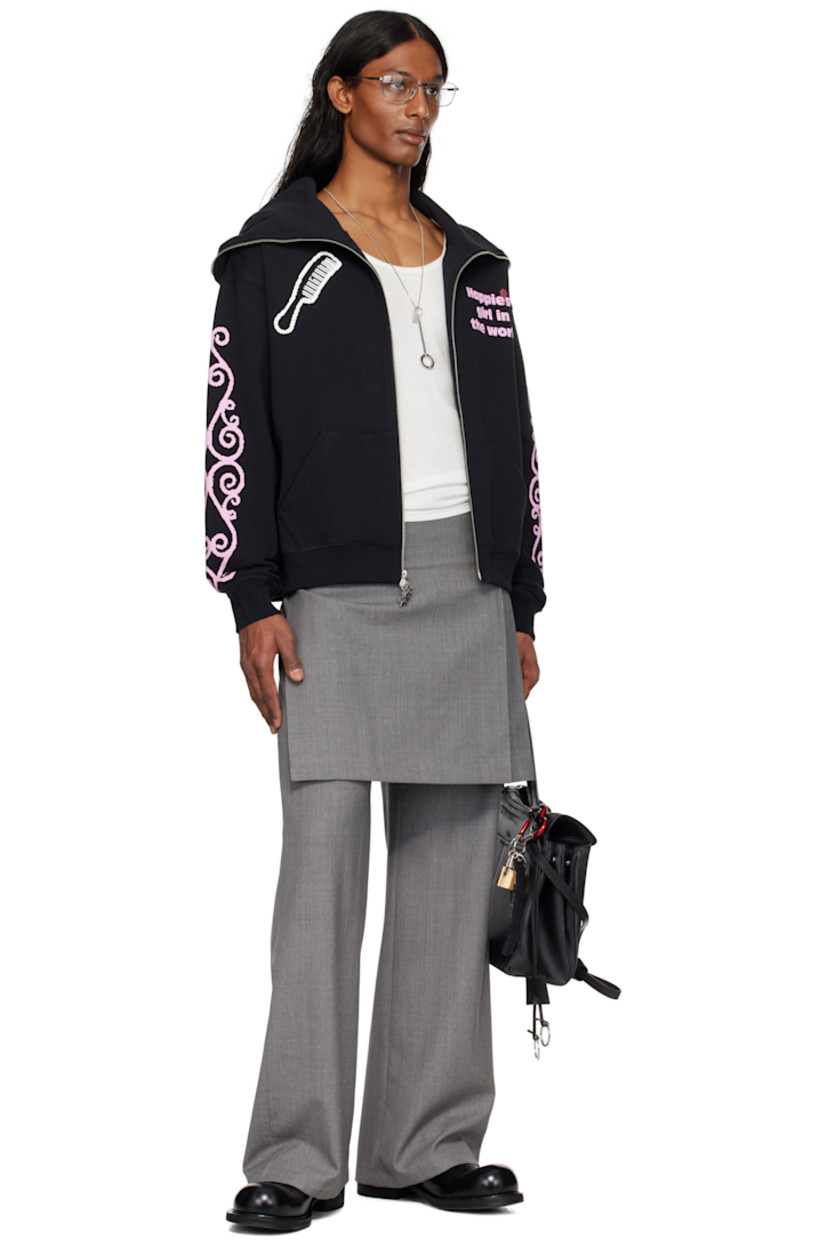 Virgin wool delaine trousers.

· Layered construction
· Pleated kilt-style overlay at waist
· Concealed zip fly
· Pin-buckle straps at outseam

Supplier color: Grey