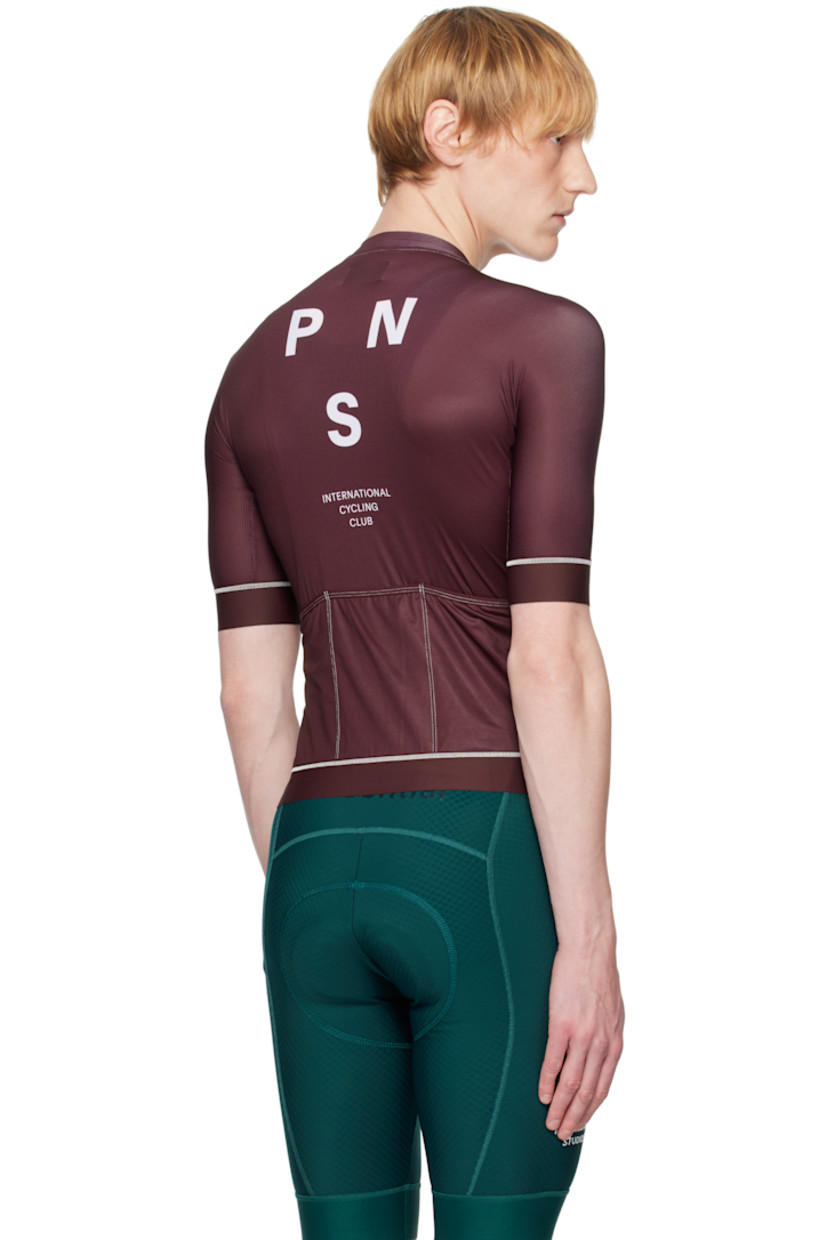 Lightweight stretch polyester jersey and mesh T-shirt. Overlock stitching throughout. 

· Paneled construction
· Band collar
· Zip closure
· Logo printed at chest and back
· Anti-slip silicone trim at elasticized hem and cuffs
· Zip seam pocket
· Logo flag at side seam
· Raglan sleeves
· Patch pockets at back

Supplier color: Burgundy