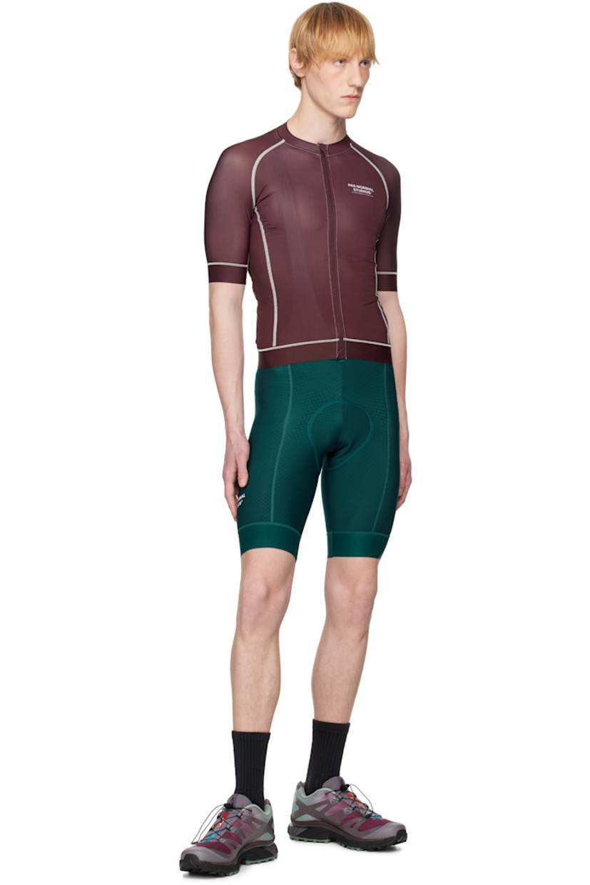 Lightweight stretch polyester jersey and mesh T-shirt. Overlock stitching throughout. 

· Paneled construction
�· Band collar
· Zip closure
· Logo printed at chest and back
· Anti-slip silicone trim at elasticized hem and cuffs
· Zip seam pocket
· Logo flag at side seam
· Raglan sleeves
· Patch pockets at back

Supplier color: Burgundy