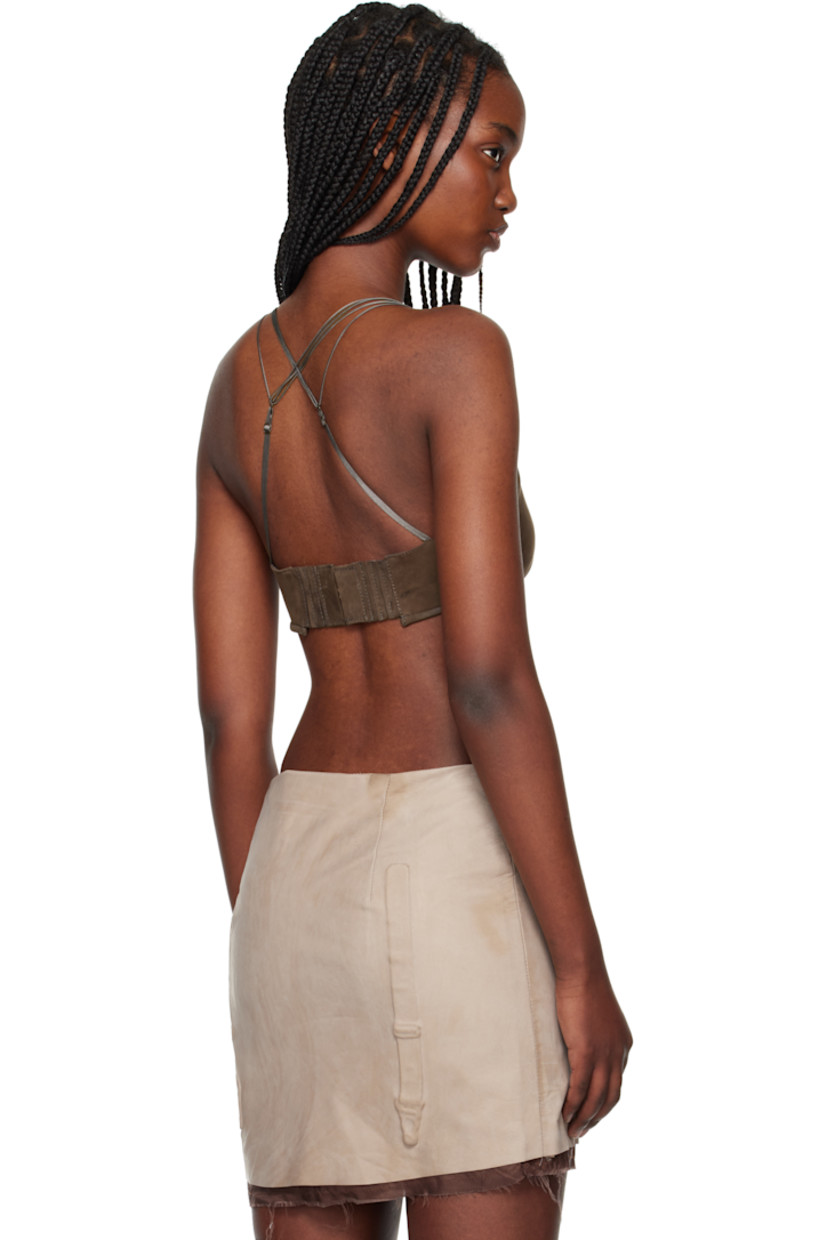 Handcrafted nubuck bra.

· V-neck
· Darts at chest 
· Padded cups
· Adjustable crisscrossing shoulder straps
· Elasticized and adjustable hook-eye closure at back
· Full silk satin lining 

Supplier color: Mud