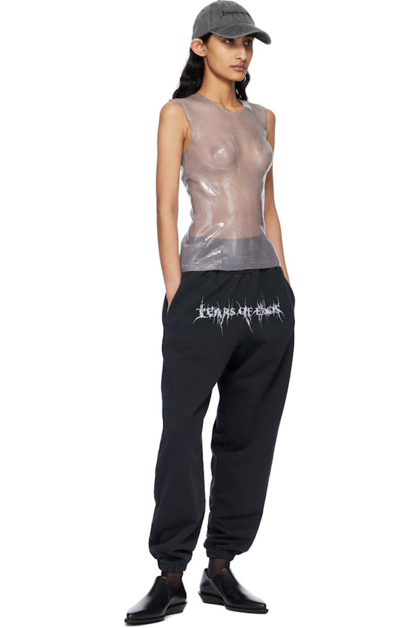 Oversized organic cotton French terry sweatpants. Fading throughout.

· Pre-shrunk
· Concealed drawstring at elasticized waistband
· Three-pocket styling
· Text printed at front
· Elasticized cuffs

Supplier color: Washed black