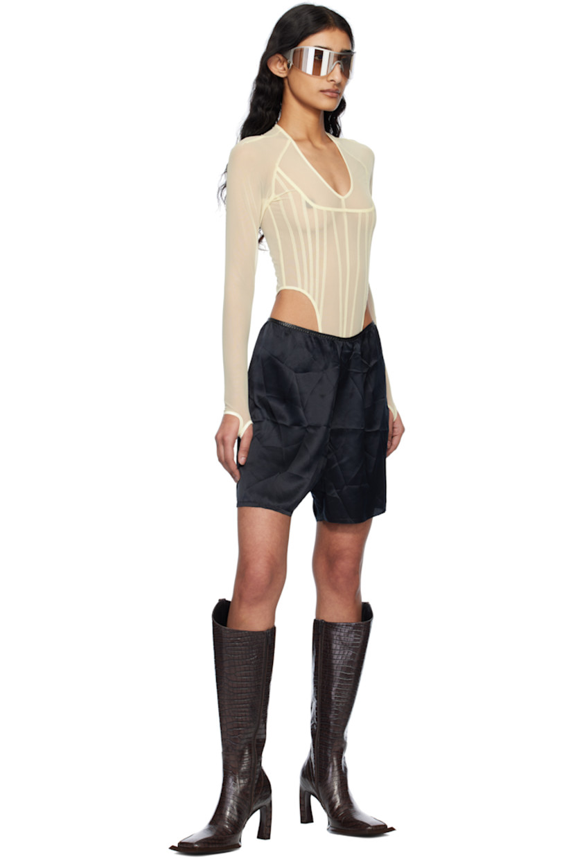 Silk satin shorts. 

· Elasticized faux-leather waistband
· Mock fly
· Raw edge at cuffs

Supplier color: Black