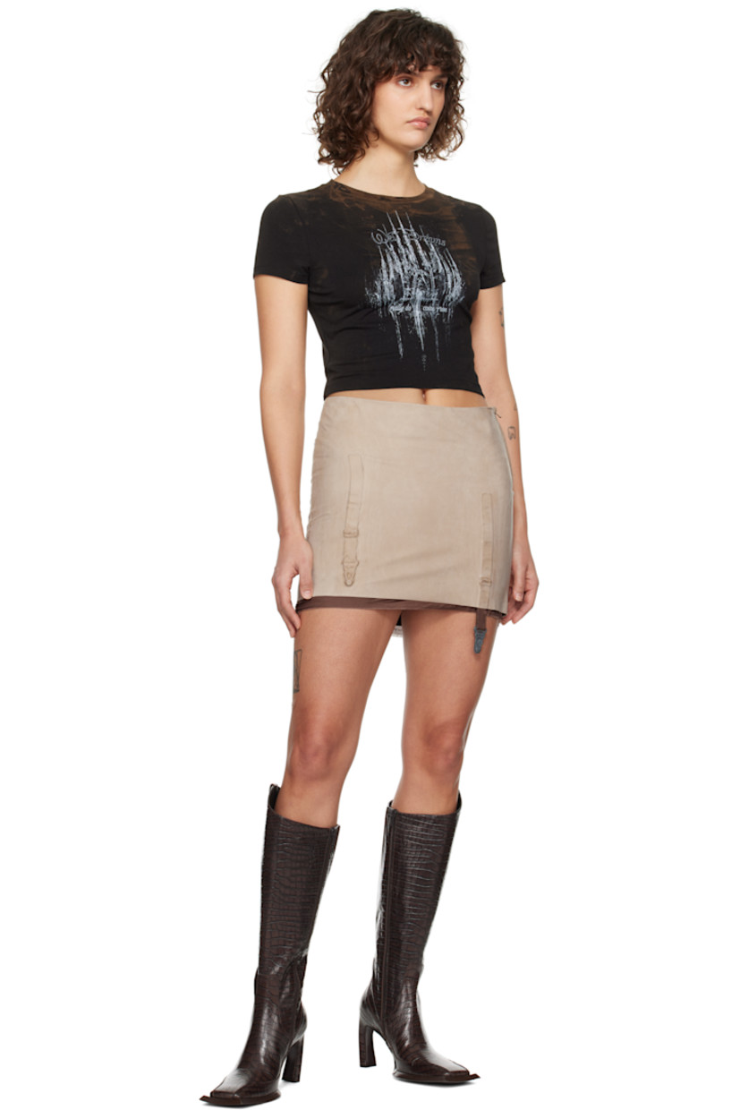 Grained leather miniskirt. Fading throughout.

· Molded garter straps at front and back
· Raw edge at hem
· Zip closure at side seam
· Full silk satin lining

Supplier color: Nude