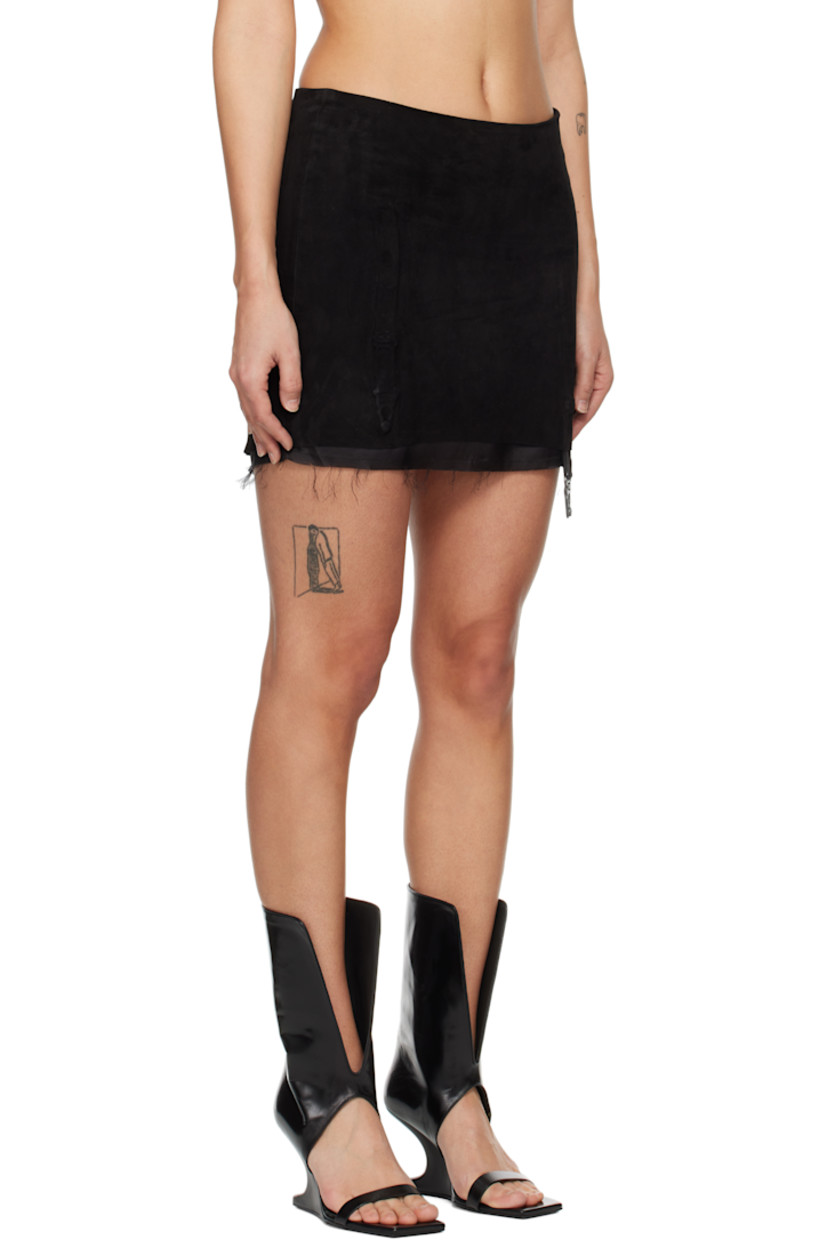 Suede miniskirt. Fading throughout.

· Molded garter straps at front and back
· Raw edge at hem
· Zip closure at side seam
· Full silk satin lining

Supplier color: Black