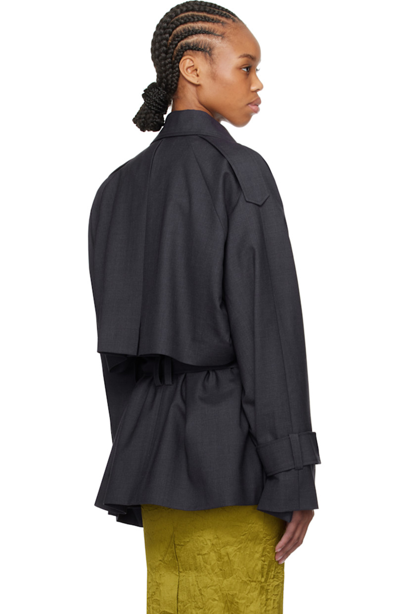 Virgin wool twill jacket.

· Notched lapel
· Open front
· Belt loops and self-tie belt
· Epaulets 
· Raglan sleeves
· Belt loops and fixed tab at cuffs
· Storm flap at back
· Partial satin lining

Supplier color: Navy