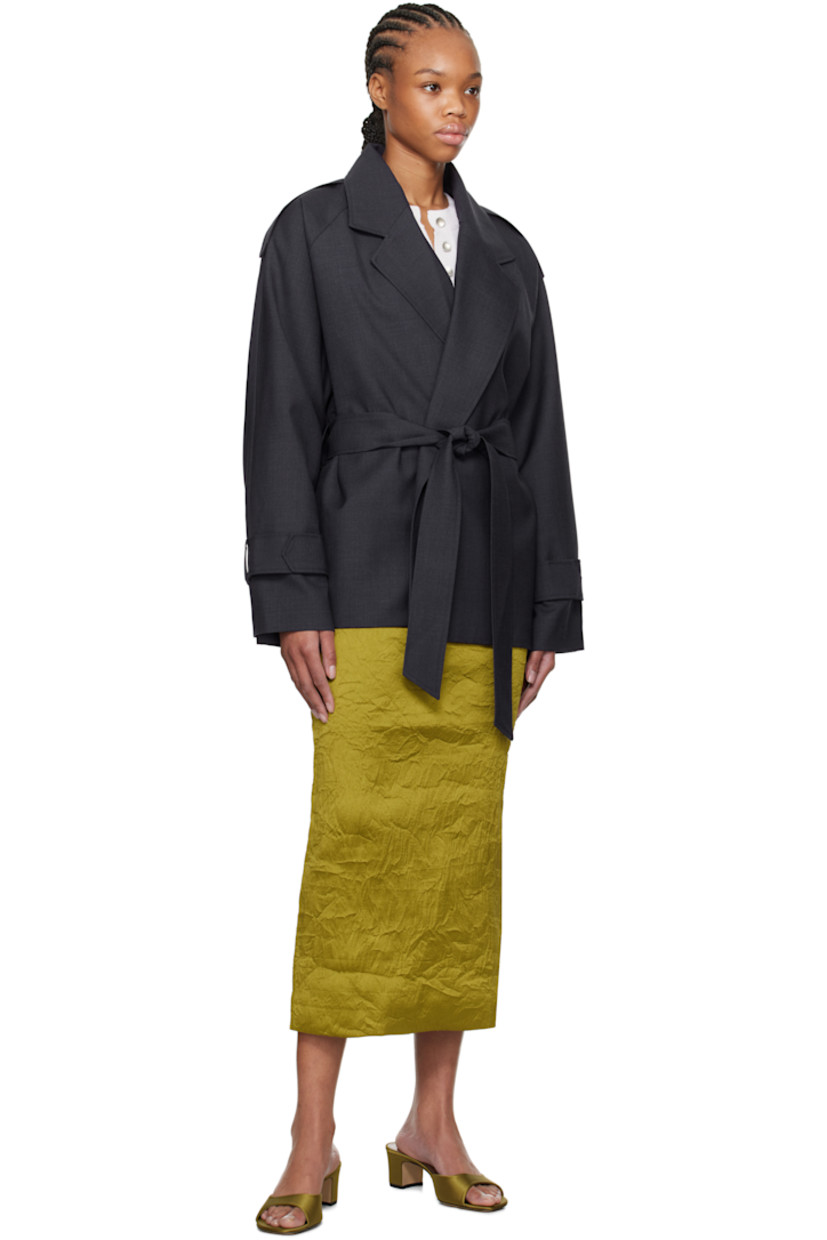 Virgin wool twill jacket.

· Notched lapel
· Open front
· Belt loops and self-tie belt
· Epaulets 
· Raglan sleeves
· Belt loops and fixed tab at cuffs
· Storm flap at back
· Partial satin lining

Supplier color: Navy