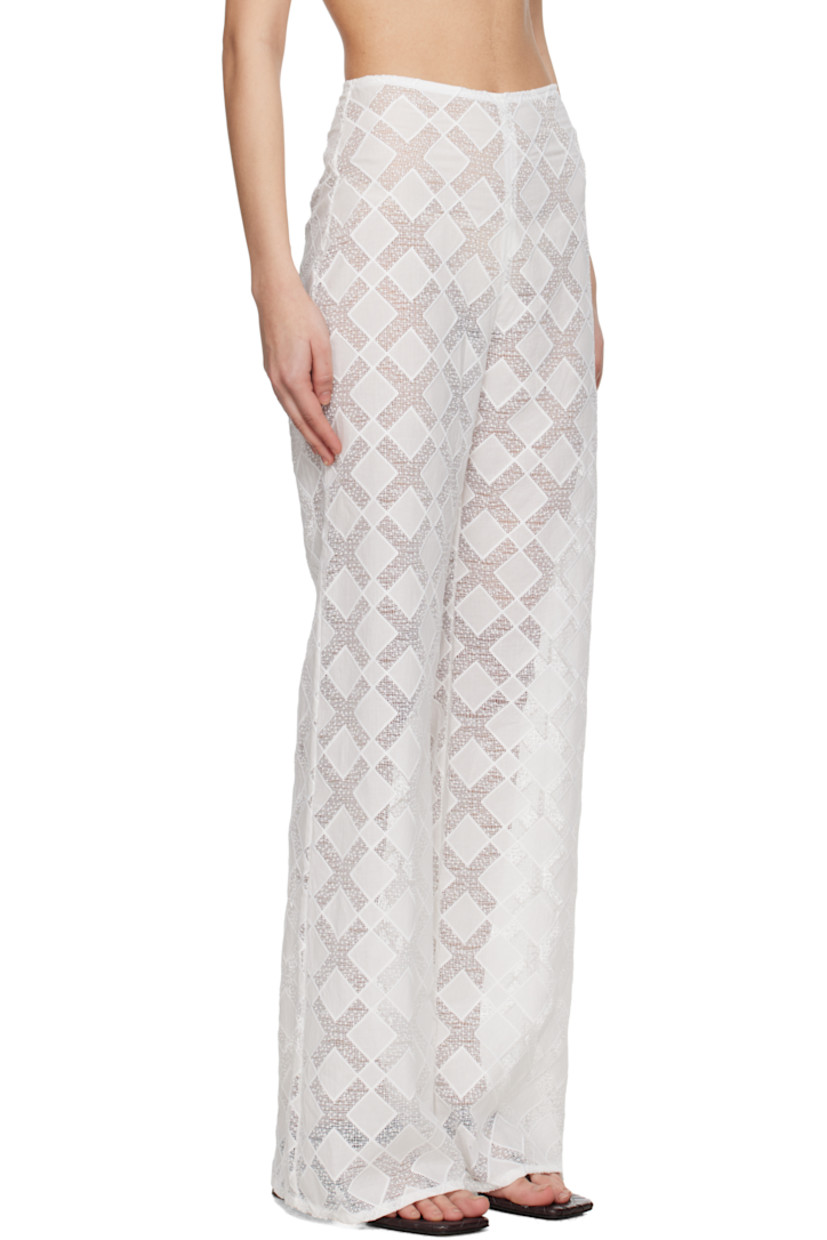 Semi-sheer nylon- and cotton-blend voile trousers. 

· Loose-fit
· Concealed grosgrain trim at waistband
· Concealed zip closure at side

Supplier color: White