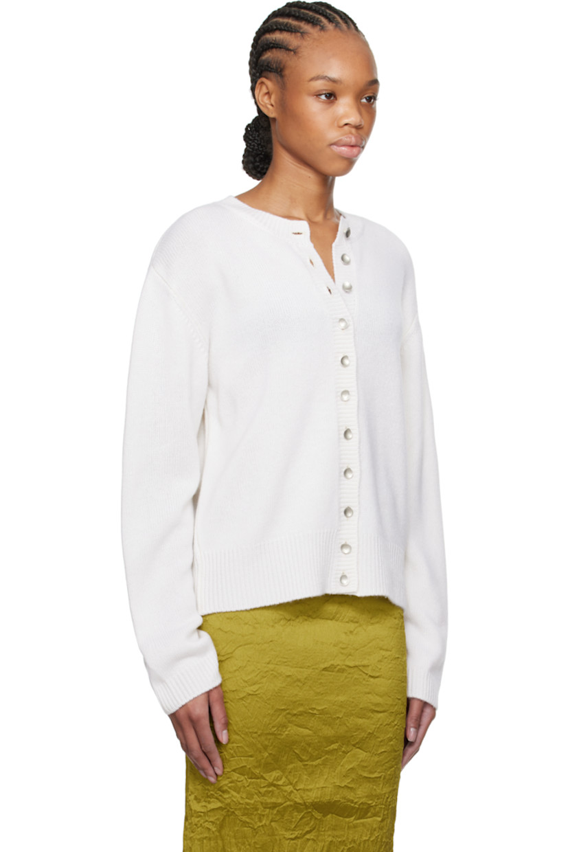 Knit cashmere cardigan.

· Rib-knit crewneck, hem, and cuffs
· Button closure
· Silver-tone hardware

Supplier color:  Soft white