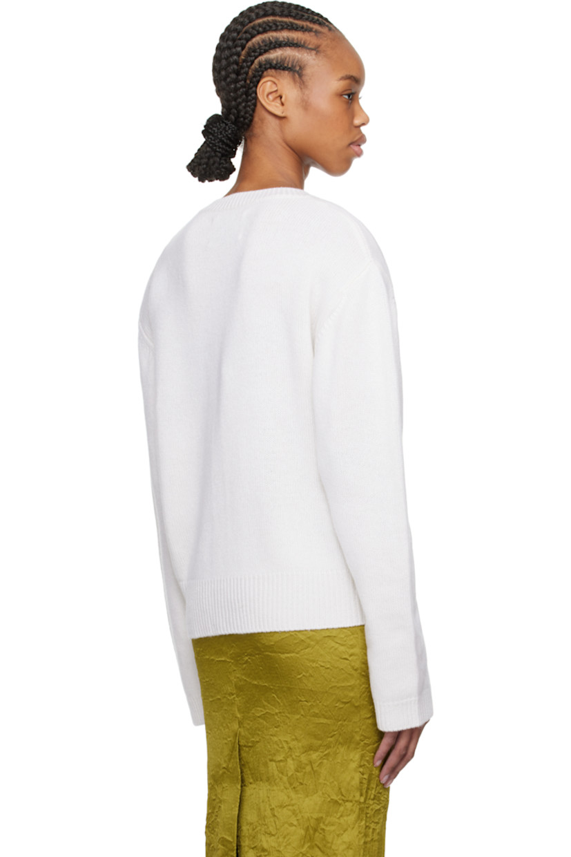 Knit cashmere cardigan.

· Rib-knit crewneck, hem, and cuffs
· Button closure
· Silver-tone hardware

Supplier color:  Soft white