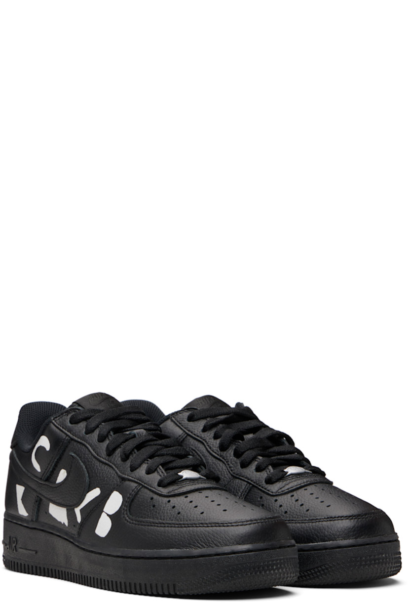 Low-top grained leather sneakers.

· Perforations at toe and sides
· Logo plaque at lace-up closure
· Padded tongue and collar
· Swoosh appliqué at sides
· Text printed at outer side
· Logo printed at inner side
· Logo embroidered at heel tab
· Mesh lining
· Treaded rubber sole

Part of the Comme des Garçons Black x Nike collaboration. 

Supplier color: Black/White