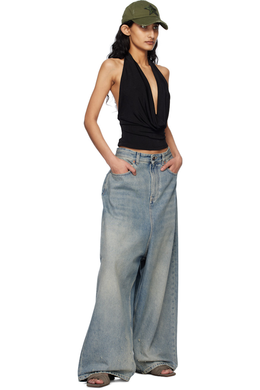 Knit stretch polyester top. 

· Plunging cowl neck
· Fixed halter strap
· Open back

Supplier color: Black