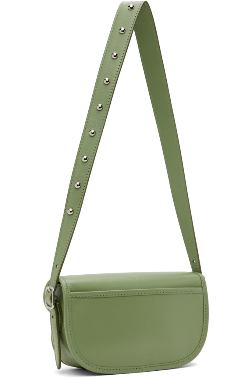 Grained buffalo leather shoulder bag in green.

· Adjustable and detachable studded shoulder strap
· Adjustable and detachable crossbody strap
· Silver-tone logo stamp at face
· Patch pocket at back face
· Safety pin and logo charm at tab-slot flap
· Magnetic closure
· Patch pocket at interior
· Faille lining
· Logo-engraved silver-tone hardware
· H5" x W7.5" x D2"

Supplier color: Oil green
