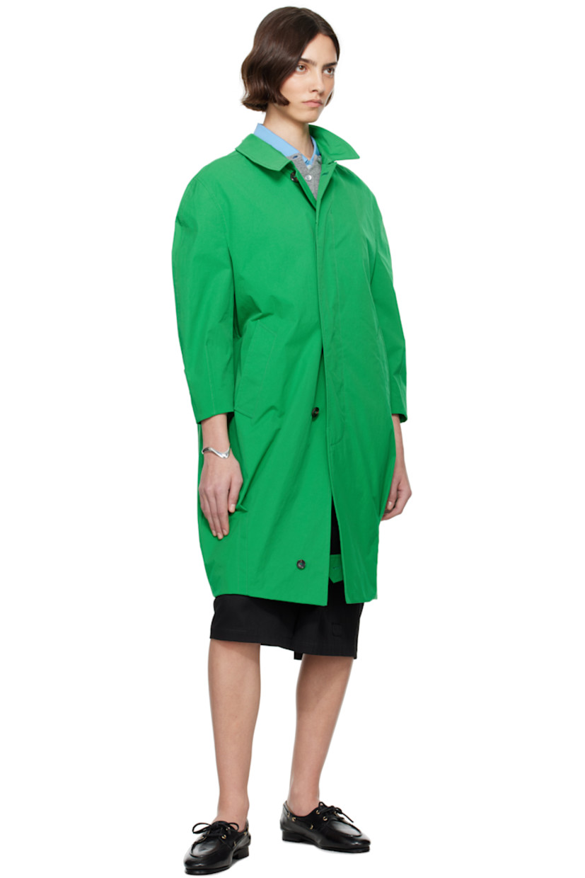 Polyester twill coat.

· Spread collar
· Concealed button closure
· Welt pockets
· Darts at front and back
· Concealed button tab at front hem
· Adjustable button tab at cuffs
· Zip pocket at interior
· Full plain-woven lining

Supplier color: Fern green