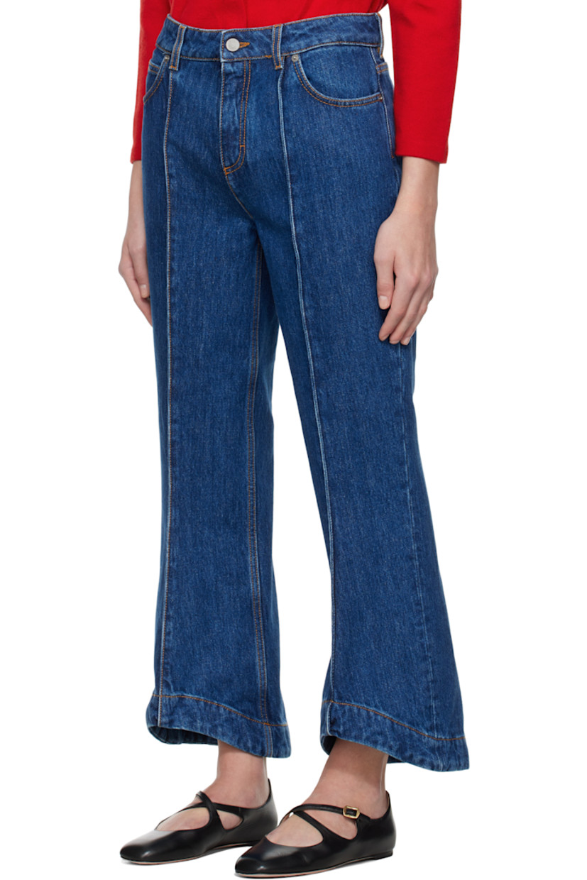 Flared non-stretch denim jeans. 

· Belt loops
· Five-pocket styling
· Zip fly
· Pinched seams at front 
· Slanted cuffs
· Cropped legs
· Logo patch at back waistband
· Contrast stitching in tan

Supplier color: Blue