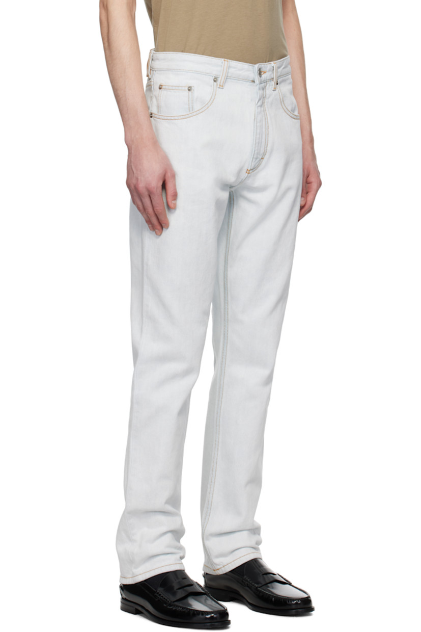 Non-stretch denim jeans. Fading throughout.

· Belt loops
· Five-pocket styling
· Zip fly
· Leather logo patch at back waistband
· Logo-engraved silver-tone hardware
· Contrast stitching in tan

Supplier color: Light blue