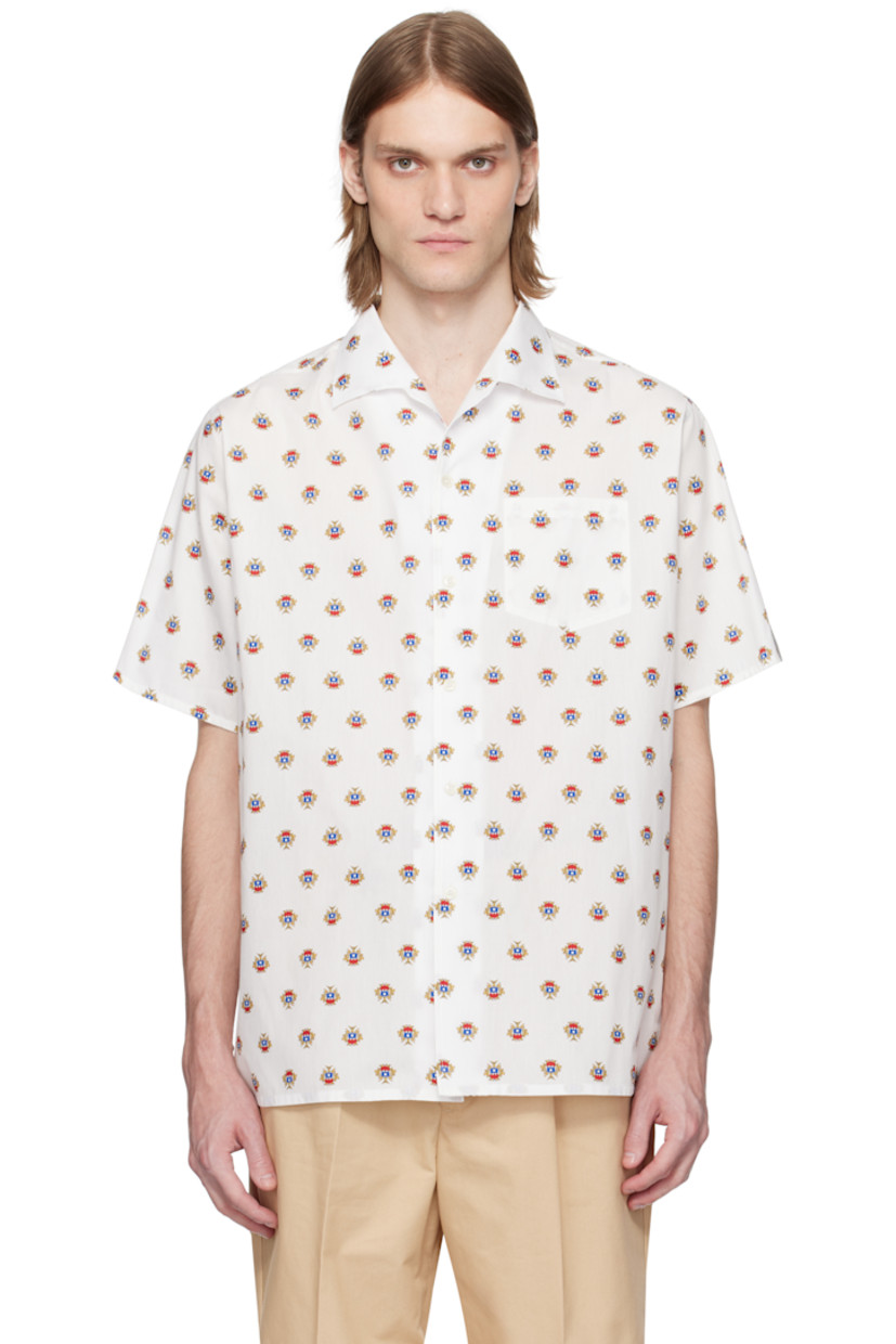 Cotton poplin shirt. Graphic pattern printed throughout.

· Open spread collar
· Button closure
· Patch pocket
· Vent at side seams
· Logo flag at cuff

Supplier color: Multibone