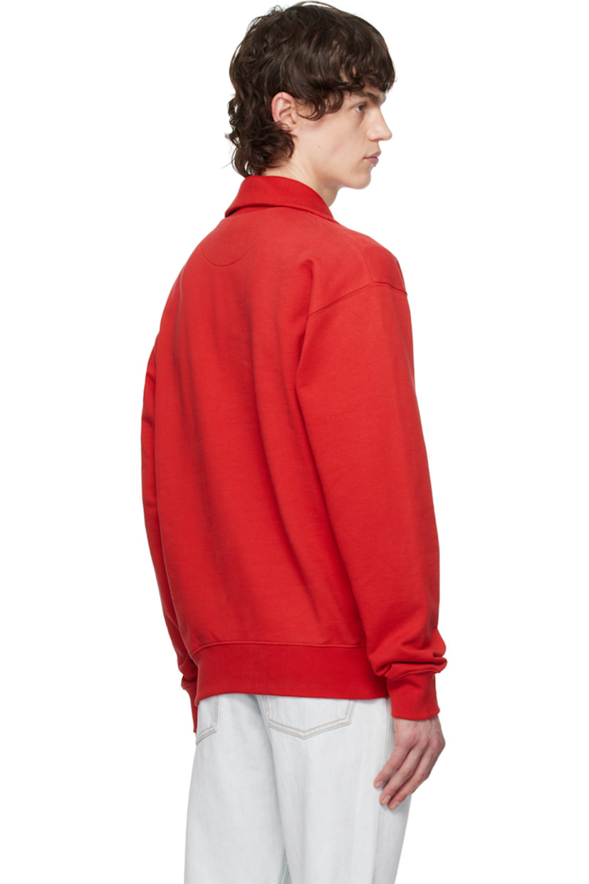 Organic cotton French terry sweatshirt. 

· Rib-knit stand collar, hem, and cuffs
· Half-zip closure
· Logo patch at chest
· Dropped shoulders

Supplier color: Swiss red