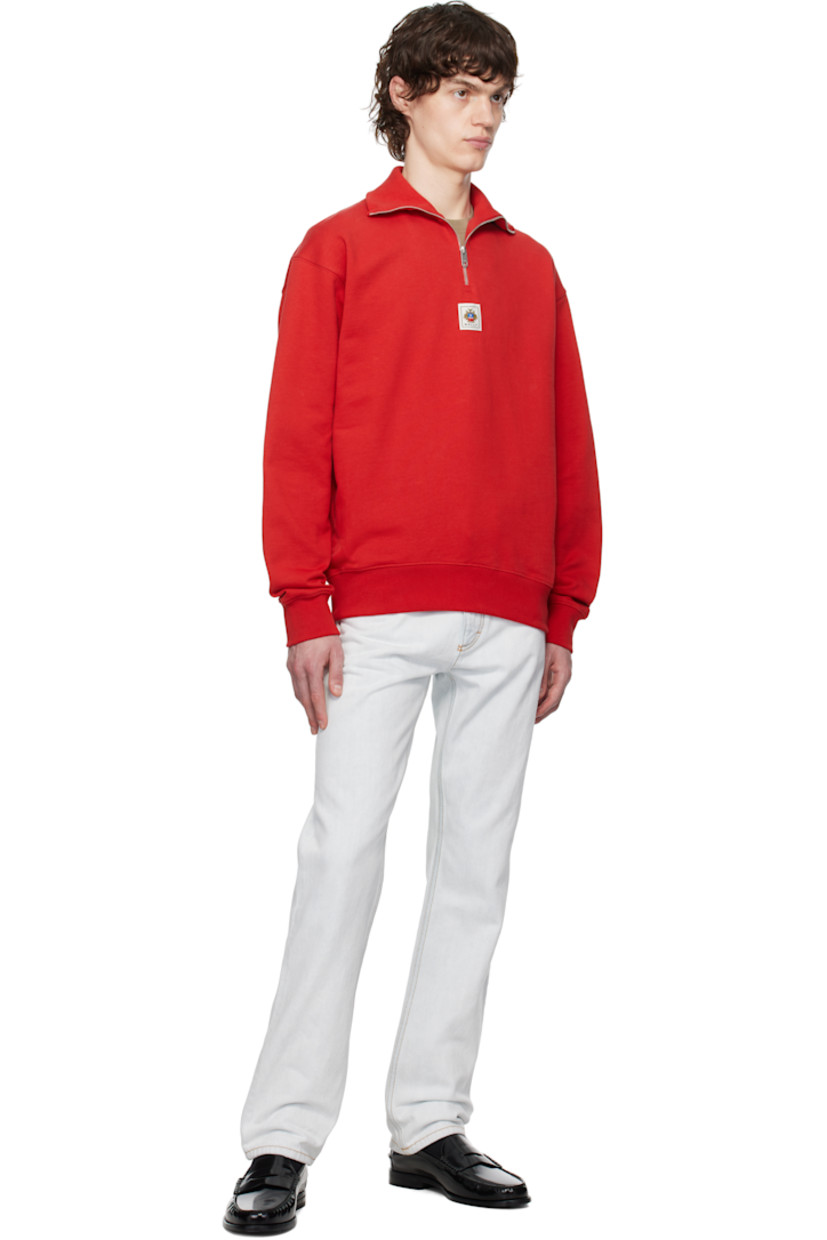 Organic cotton French terry sweatshirt. 

· Rib-knit stand collar, hem, and cuffs
· Half-zip closure
· Logo patch at chest
· Dropped shoulders

Supplier color: Swiss red