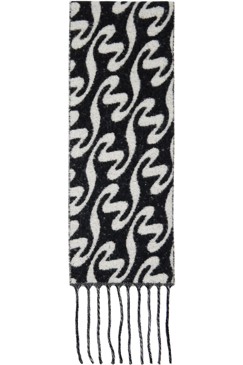 Rectangular brushed knit wool- and alpaca-blend scarf in black and white.

· Jacquard graphic pattern throughout
· Fringed trim at ends
· H72" x W9.5"

Supplier color: Black mix