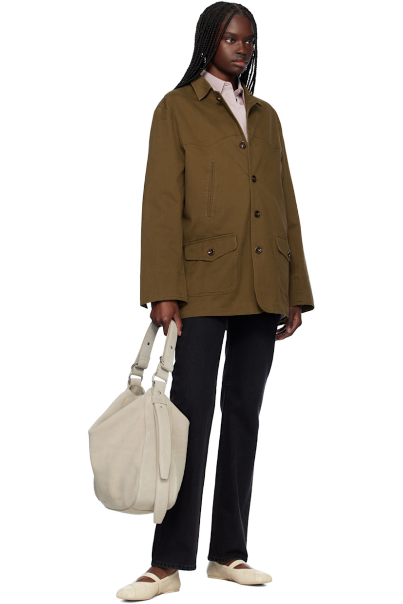 Suede shoulder bag in gray.

· Adjustable shoulder strap
· Logo hardware at face
· Adjustable and detachable post-stud strap at sides
· Magnetic flap closure
· Zip pocket at interior
· Cotton twill lining
· Silver-tone hardware
· H14.75" x W16.5" x D4.75"

Supplier color: Lt. grey