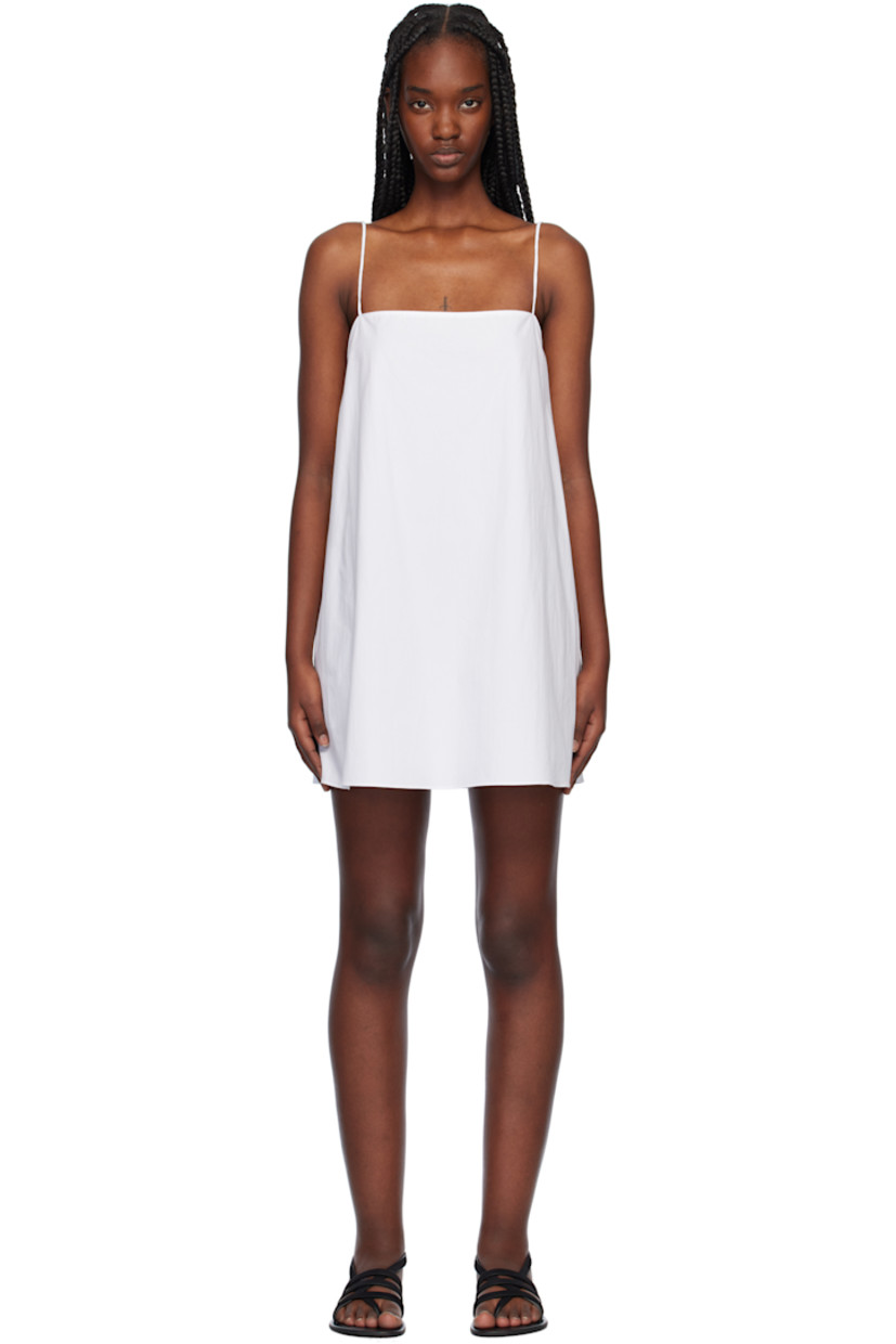 Organic cotton poplin minidress. 

· Square neck
· Seam pockets
· Fixed spaghetti straps
· Unlined

Supplier color: White