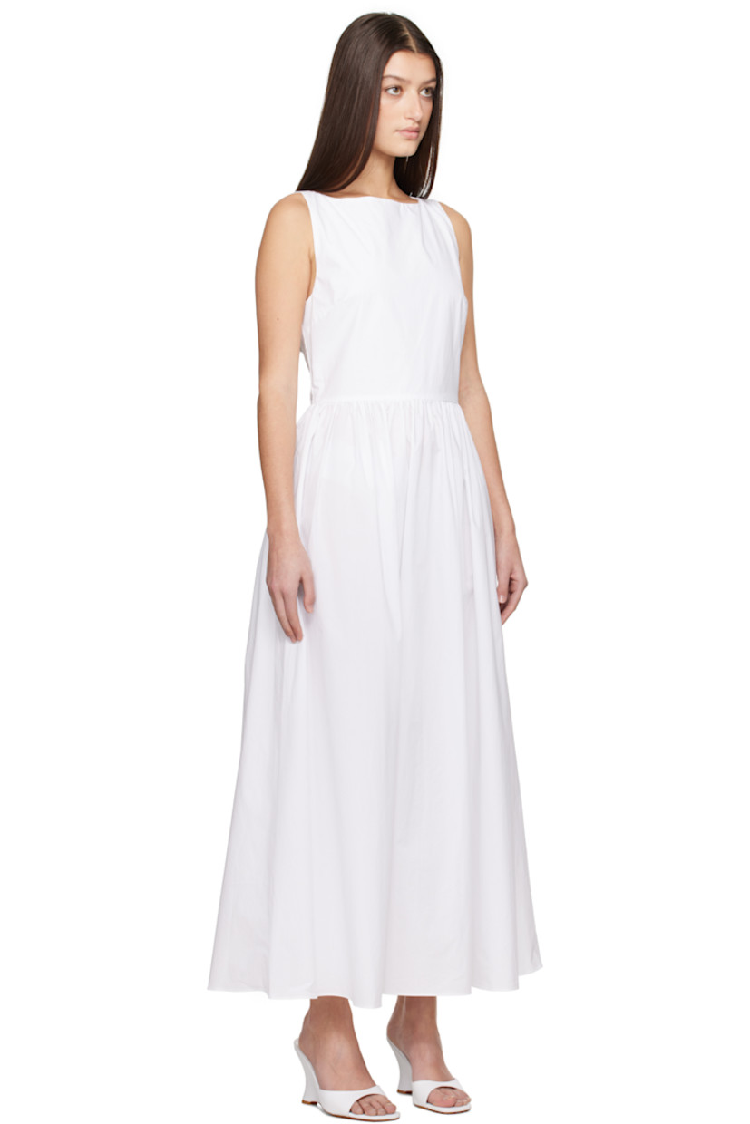 Organic cotton poplin midi dress.

· Boatneck
· Gathering at waist
· Seam pockets
· Concealed zip closure at side seam
· Self-tie straps at open back
· Concealed zip closure at back
· Unlined

Supplier color: White