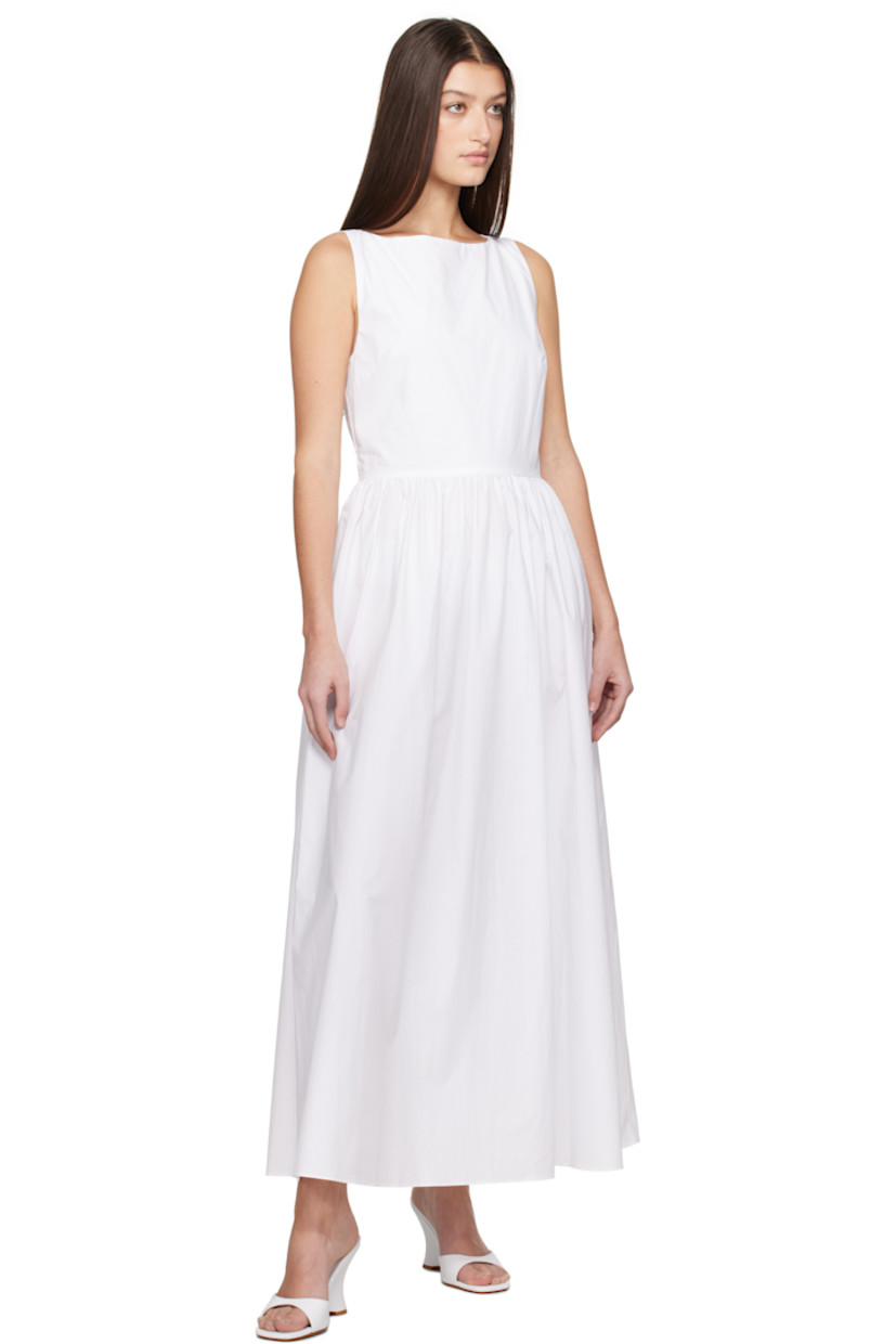 Organic cotton poplin midi dress.

· Boatneck
· Gathering at waist
· Seam pockets
· Concealed zip closure at side seam
· Self-tie straps at open back
· Concealed zip closure at back
· Unlined

Supplier color: White