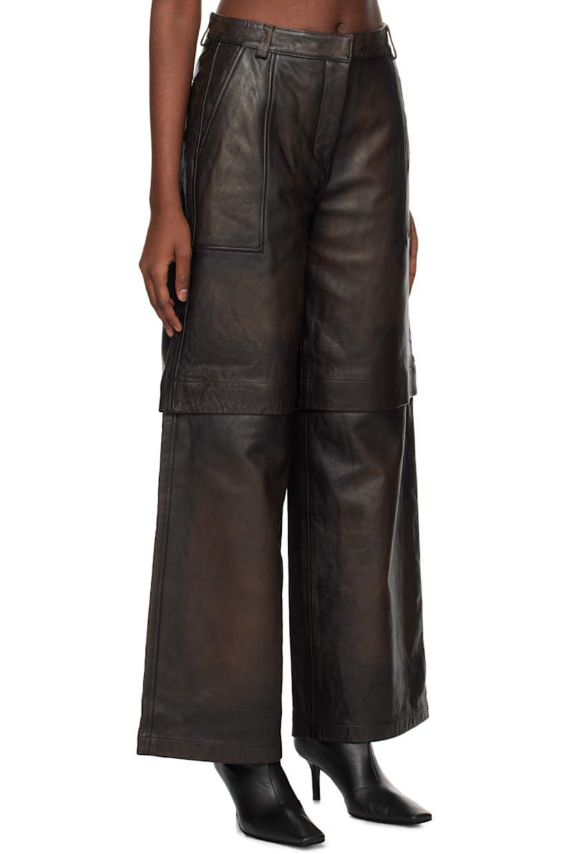 Wide-leg grained leather zip-off pants. Fading throughout.

· Belt loops
· Four-pocket styling
· Zip-fly
· Zip fastening at knees for shorts styling
· Full satin lining

Supplier color: Brown