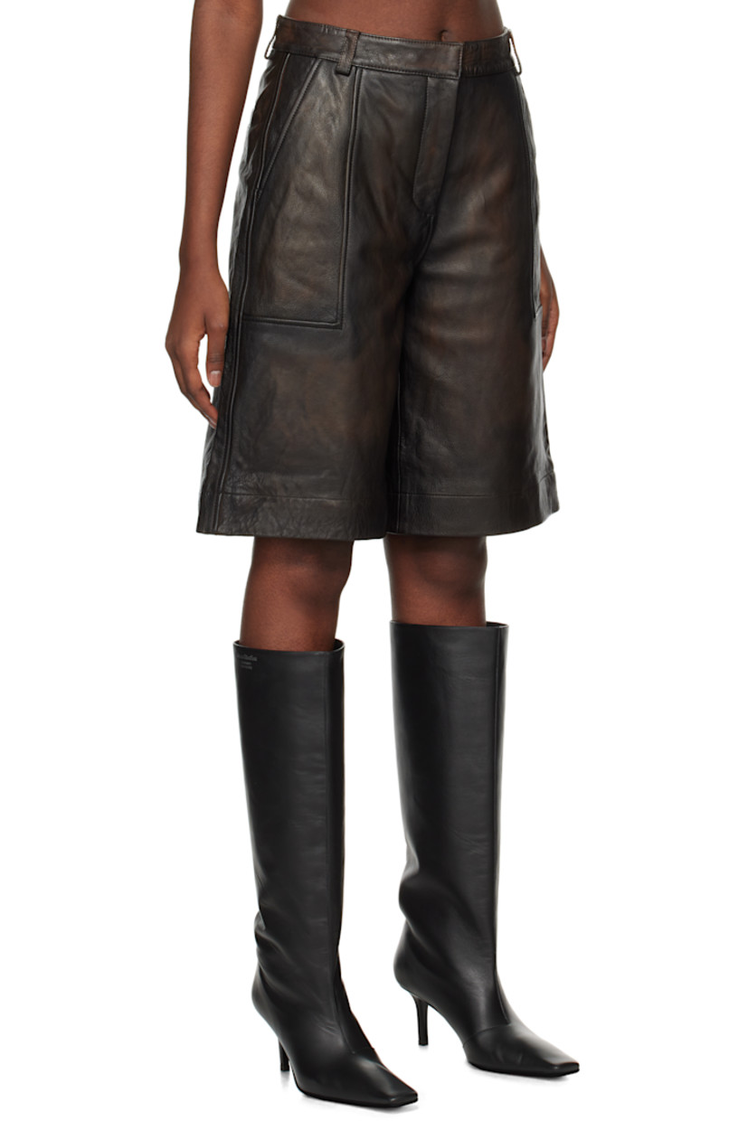 Wide-leg grained leather zip-off pants. Fading throughout.

· Belt loops
· Four-pocket styling
· Zip-fly
· Zip fastening at knees for shorts styling
· Full satin lining

Supplier color: Brown