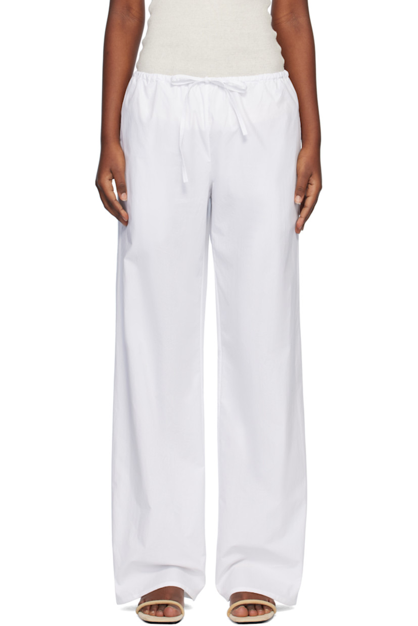 Relaxed-fit and straight-leg organic cotton poplin trousers.

· Drawstring at elasticized waistband
· Three-pocket styling

Supplier color: White