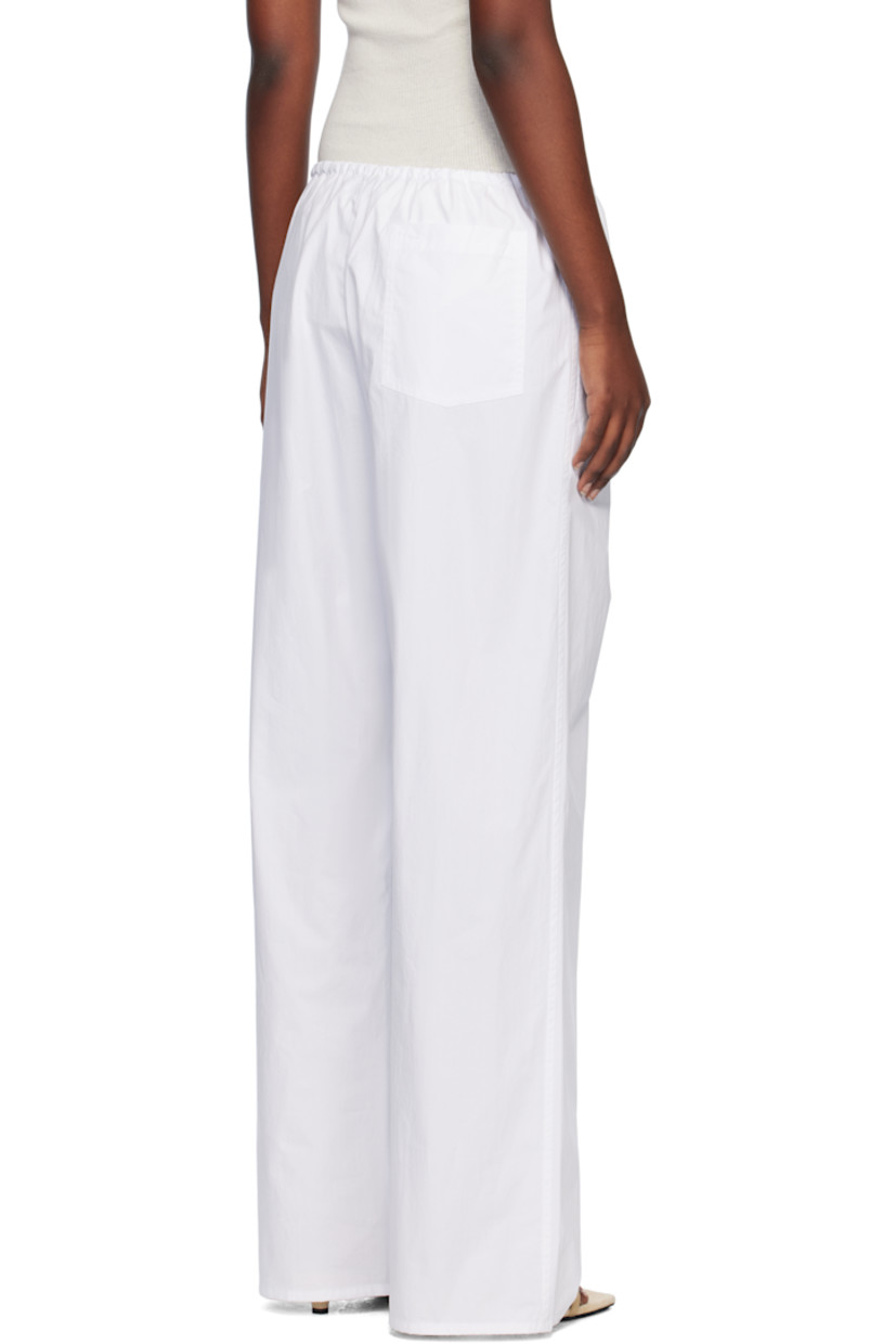 Relaxed-fit and straight-leg organic cotton poplin trousers.

· Drawstring at elasticized waistband
· Three-pocket styling

Supplier color: White