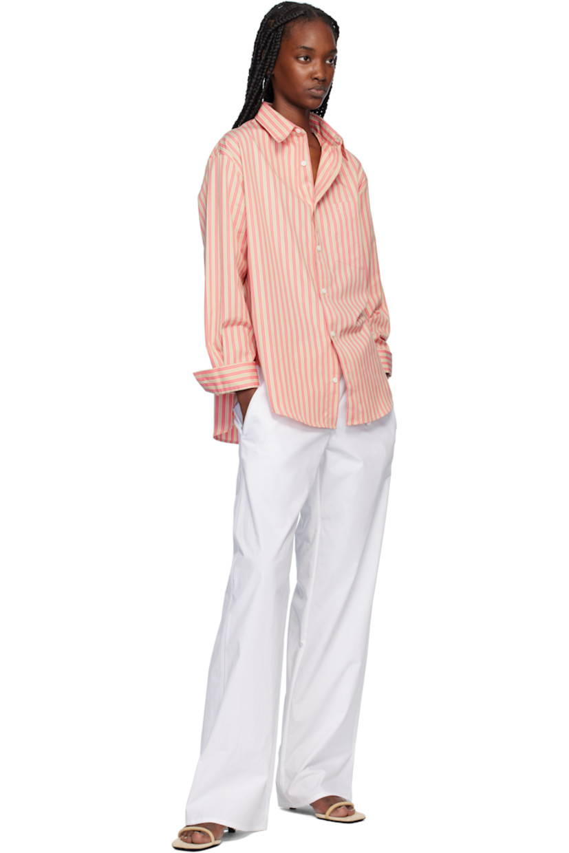 Relaxed-fit and straight-leg organic cotton poplin trousers.

· Drawstring at elasticized waistband
· Three-pocket styling

Supplier color: White