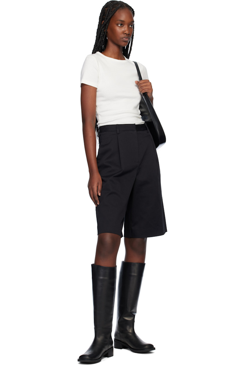 Straight-leg stretch organic cotton twill shorts. 

· High-rise
· Belt loops
· Four-pocket styling
· Zip-fly
· Pleats at front

Supplier color: Black
