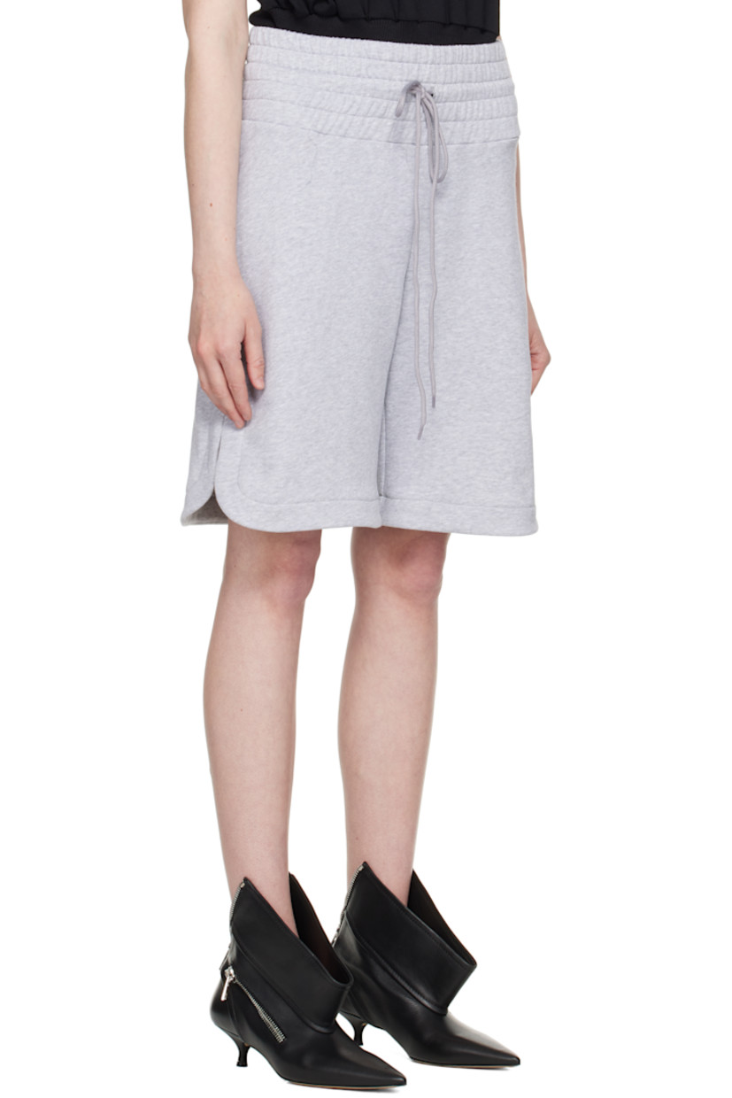 Stretch French terry shorts.

· Drawstring at elasticized waistband
· Vented cuffs

Supplier color: Grey melange