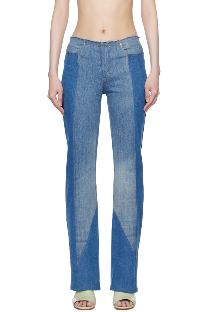 Non-stretch denim jeans. Fading throughout.

· Paneled construction
· Raw edge at modified waistband
· Four-pocket styling
· Button-fly
· Logo patch at back waistband
· Dyed detailing at back pockets
· Contrast stitching in tan

Supplier color: Denim