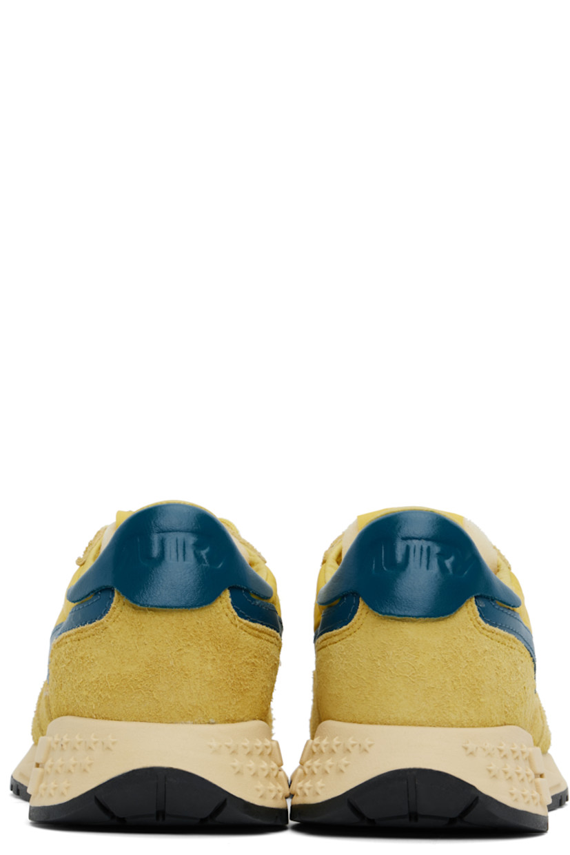 Low-top suede, buffed leather, mesh, and canvas sneakers in yellow and blue. 

· Logo-embossed rubber trim at toe
· Lace-up closure
· Logo patch at padded tongue
· Padded collar
· Logo appliqué at sides
· Inset logo patch at outer side
· Logo embossed at heel tab
· Pigskin suede and terrycloth lining
· Logo-embossed rubber midsole
· Treaded rubber sole

Supplier color: Yellow/Corsair