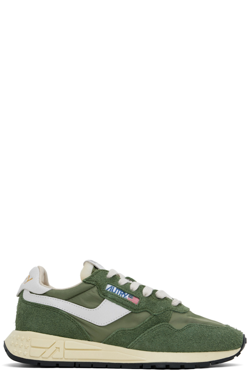 Low-top suede, crackled leather, and canvas sneakers in green and white.

· Logo-embossed rubber trim at toe
· Lace-up closure
· Logo patch at padded tongue
· Padded collar
· Logo appliqué at sides
· Inset logo patch at outer side
· Logo stamp at heel tab
· Pigskin suede and terrycloth lining
· Logo-embossed rubber midsole
· Treaded rubber sole

Supplier color: Military/White