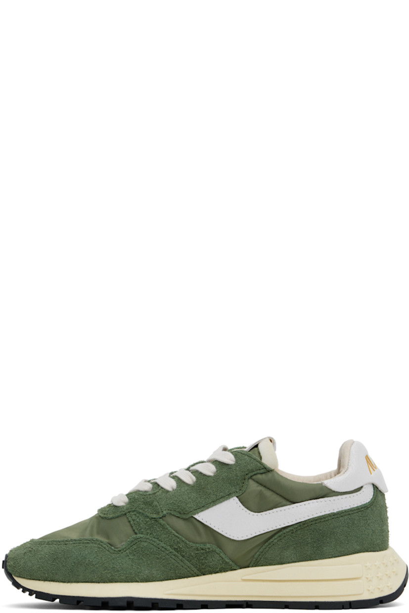 Low-top suede, crackled leather, and canvas sneakers in green and white.

· Logo-embossed rubber trim at toe
· Lace-up closure
· Logo patch at padded tongue
· Padded collar
· Logo appliqué at sides
· Inset logo patch at outer side
· Logo stamp at heel tab
· Pigskin suede and terrycloth lining
· Logo-embossed rubber midsole
· Treaded rubber sole

Supplier color: Military/White