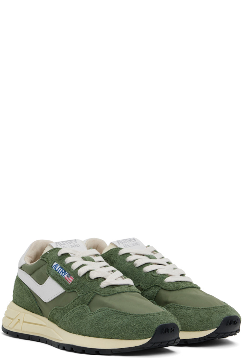 Low-top suede, crackled leather, and canvas sneakers in green and white.

· Logo-embossed rubber trim at toe
· Lace-up closure
· Logo patch at padded tongue
· Padded collar
· Logo appliqué at sides
· Inset logo patch at outer side
· Logo stamp at heel tab
· Pigskin suede and terrycloth lining
· Logo-embossed rubber midsole
· Treaded rubber sole

Supplier color: Military/White