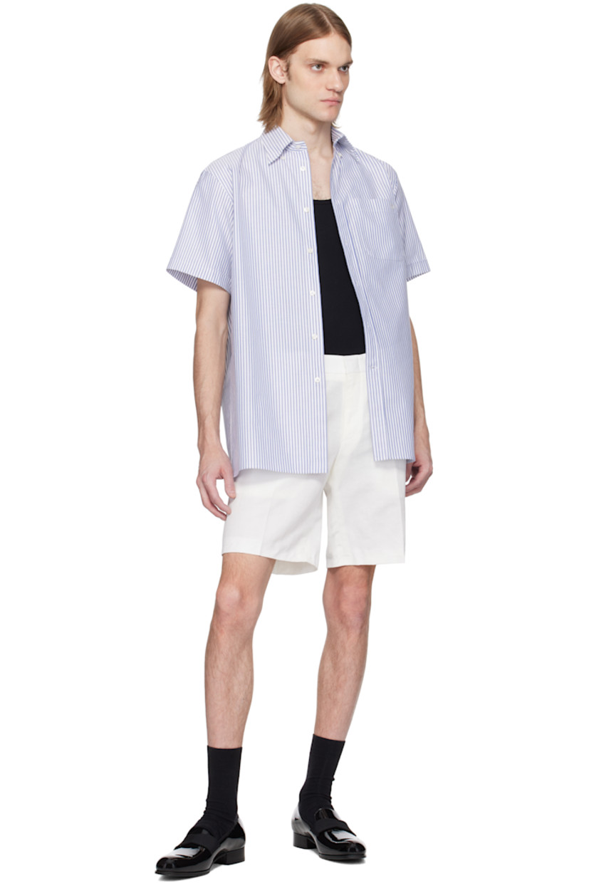 Linen- and cotton-blend gabardine shorts.

· Belt loops
· Four-pocket styling
· Zip fly
· Creased legs
· Loose thread detailing at cuffs

Supplier color: Off-white