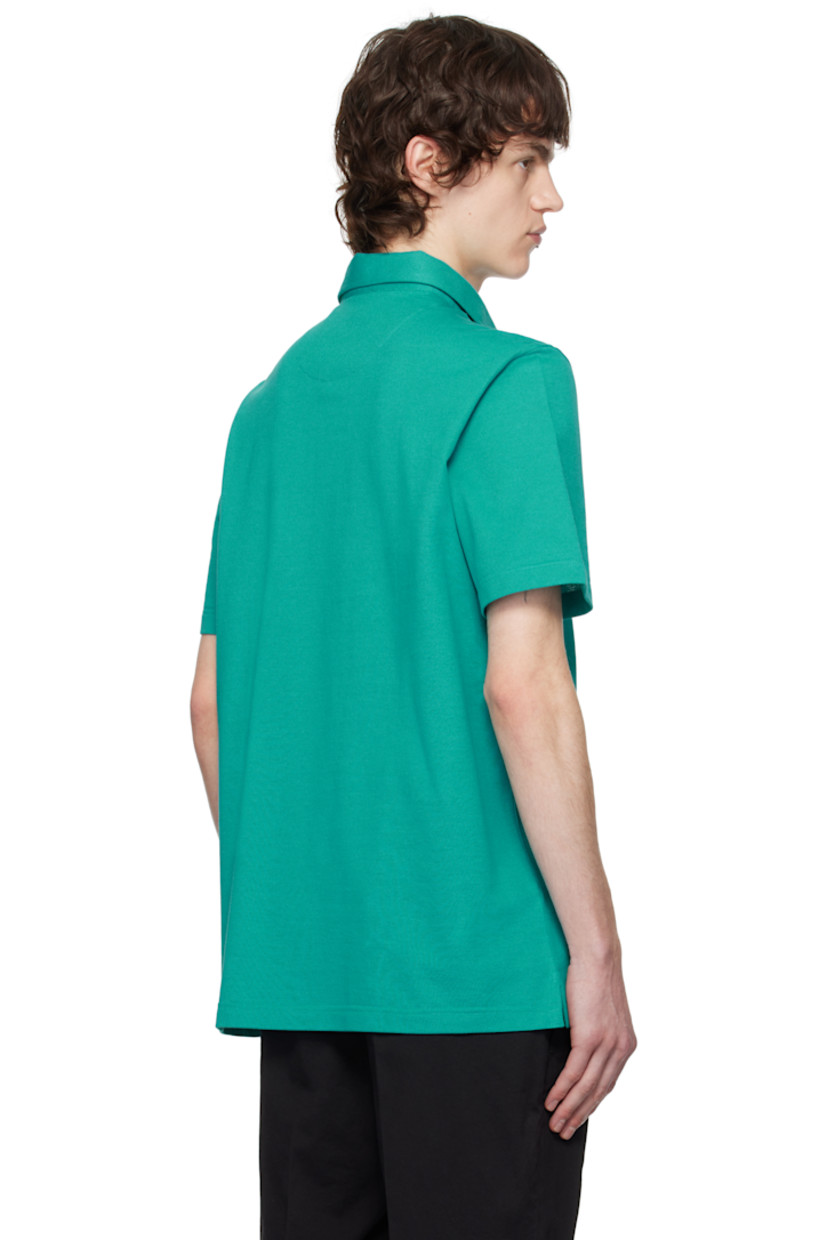 Cotton piqué polo.

· Spread collar
· Three-button placket
· Logo patch at tennis-tail hem

Supplier color: Emerald/Aqua