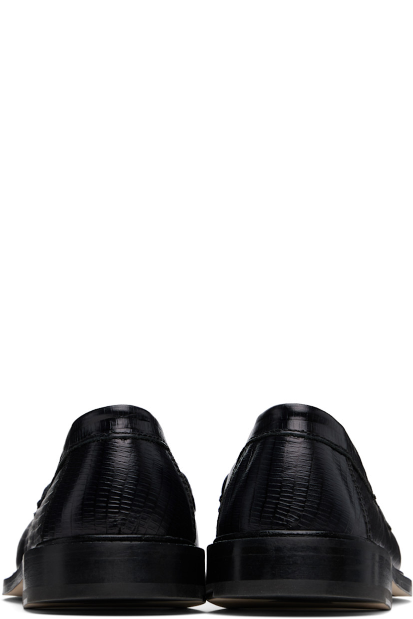 Handcrafted lizard-embossed leather loafers in black.

· Moc toe
· Strap with cutout at vamp
· Buffed leather and suede lining
· Serrated edge at welt
· Stacked leather heel with rubber injection
· Leather sole

Supplier color: Black lizard