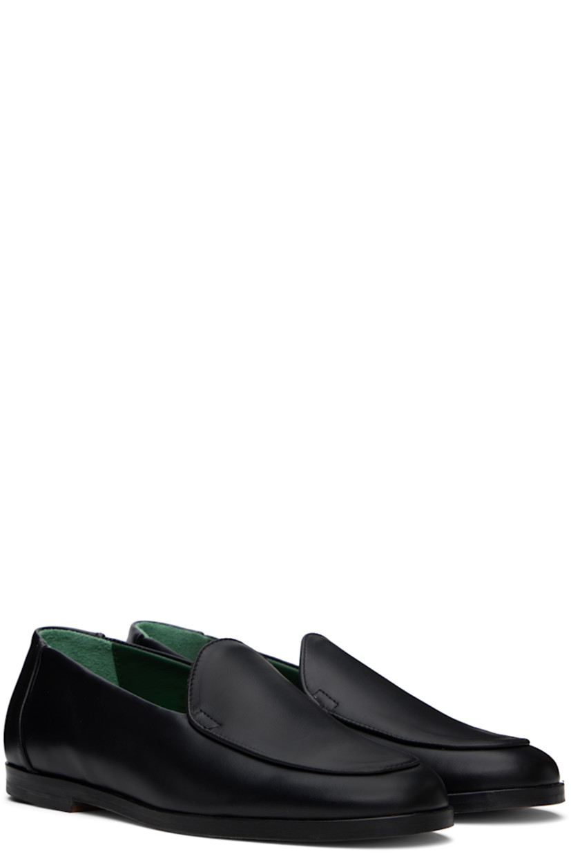 Handcrafted nappa leather loafers in black.

· Moc toe
· Buffed leather and suede lining
· Stacked leather heel with rubber injection
· Leather sole

Supplier color: Black