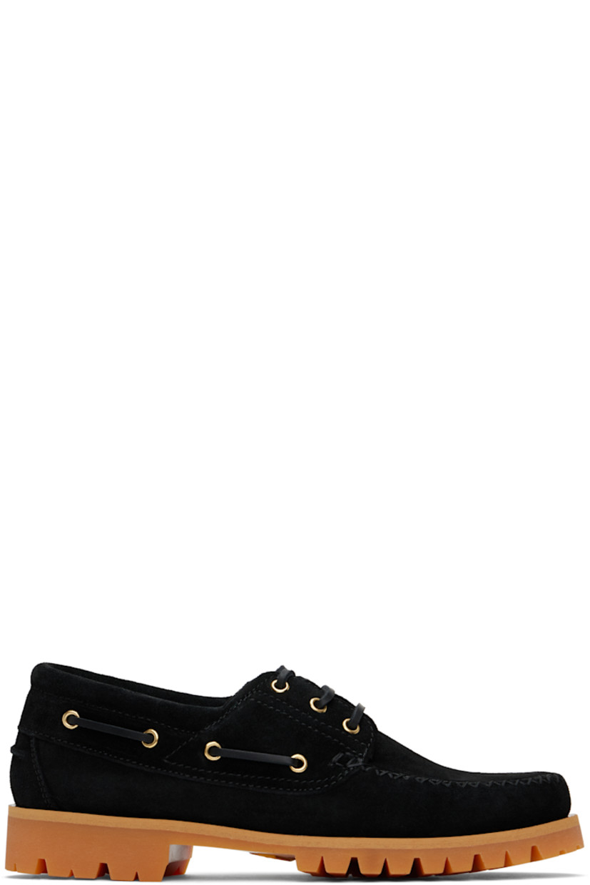 Suede boat shoes in black.

· Moc toe
· Lace-up closure
· Pinched seam at heel counter
· Buffed leather lining
· Treaded Vibram® rubber sole

Supplier color: Black