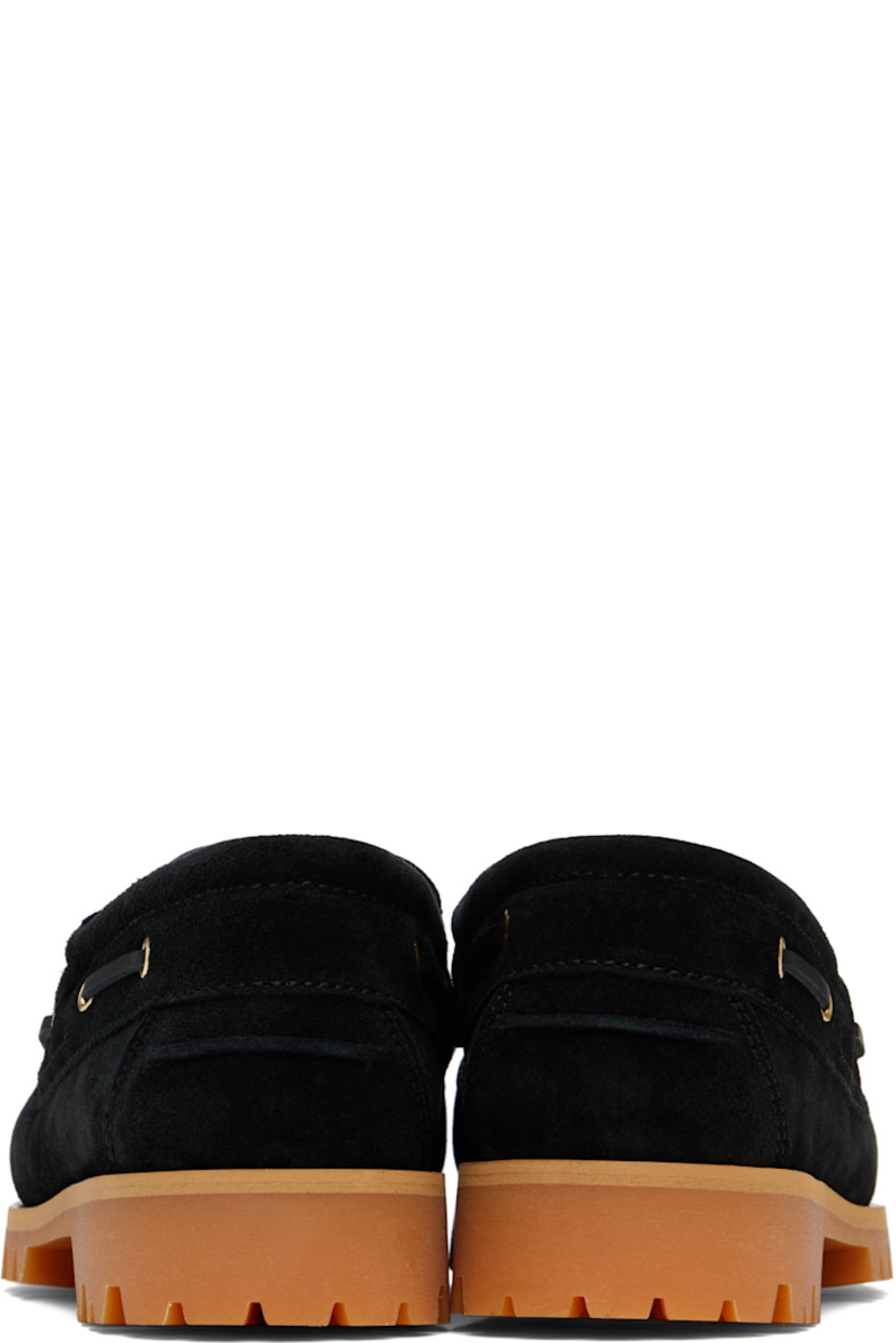 Suede boat shoes in black.

· Moc toe
· Lace-up closure
· Pinched seam at heel counter
· Buffed leather lining
· Treaded Vibram® rubber sole

Supplier color: Black