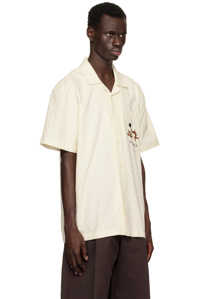 Organic cotton twill shirt. Jacquard pattern woven throughout.

· Open spread collar
· Button closure
· Embroidered logo graphic at patch pocket

Supplier color: Off-White