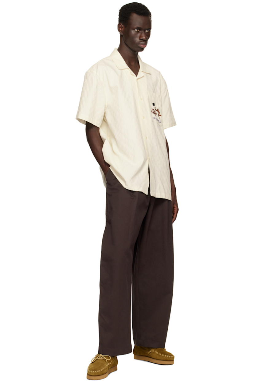 Organic cotton twill shirt. Jacquard pattern woven throughout.

· Open spread collar
· Button closure
· Embroidered logo graphic at patch pocket

Supplier color: Off-White