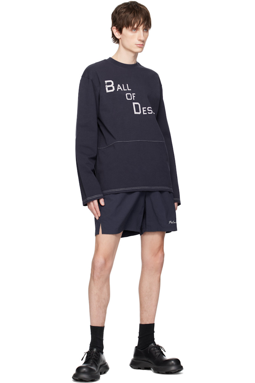 Polyester taffeta shorts.

· Concealed drawstring at elasticized waistband
· Two-pocket styling 
· Logo embroidered at leg
· Vented cuffs

Supplier color: Dark blue